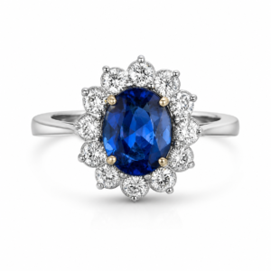 Anel em ouro branco com pedra central azul oval